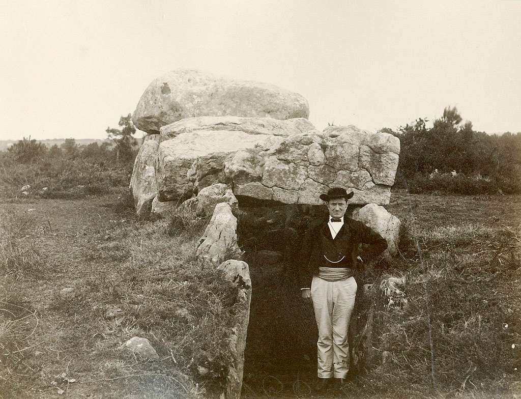 Man at a dolmen at Mané-Kerioned, Carnac, Britanny, France - PICRYL Public Domain Search