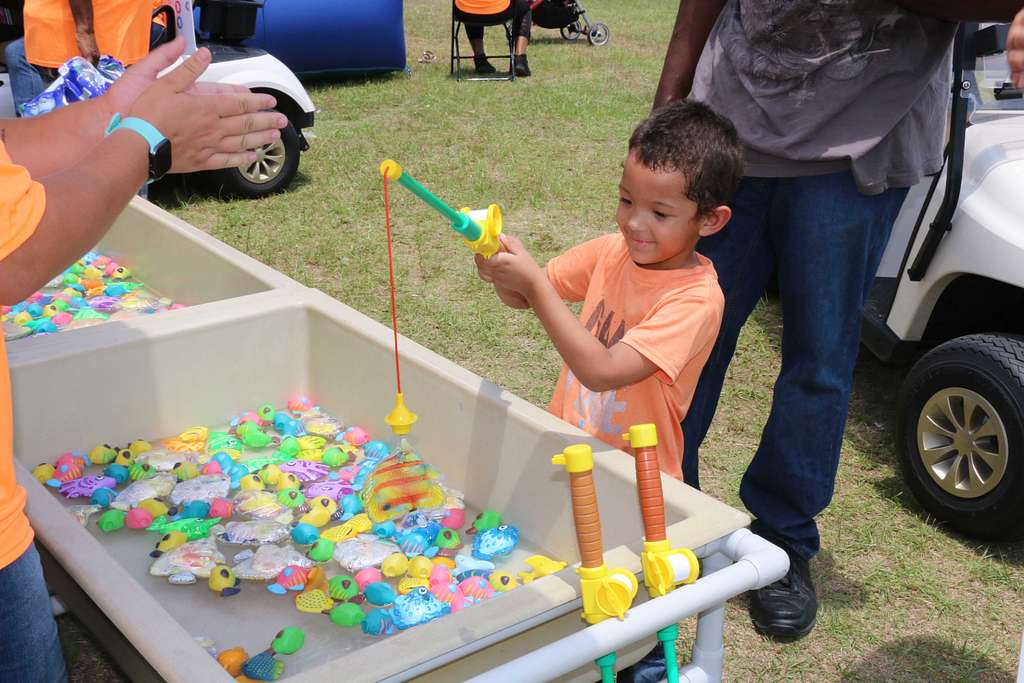 Major, 4, reels in a catch during a youth fishing trip - NARA