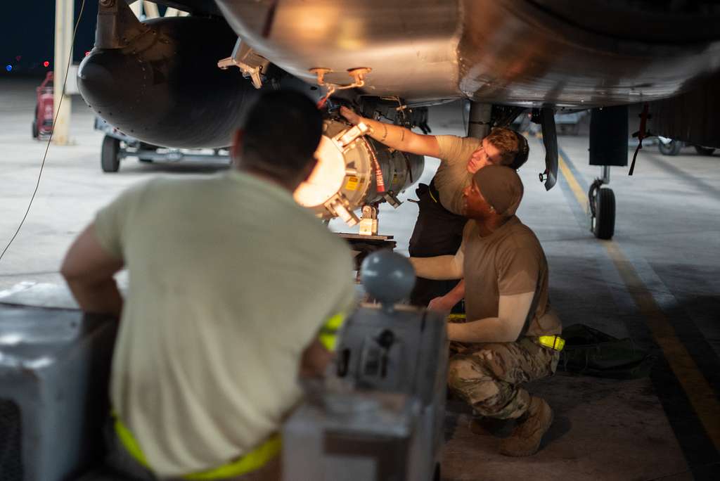 An F-15E Strike Eagle weapons load crew team attaches - NARA & DVIDS ...