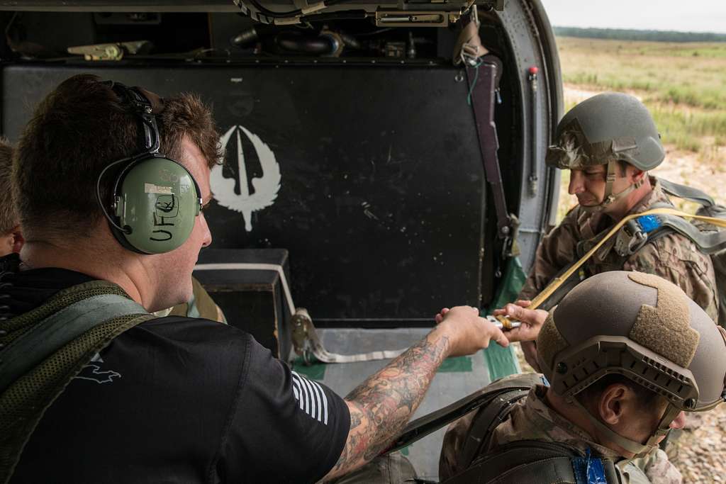 An U.S. soldier conducts a static line jump from an - NARA & DVIDS