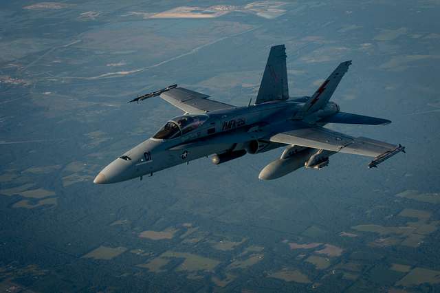 A U.S. Navy F/A-18E Super Hornet departs after receiving - NARA & DVIDS ...