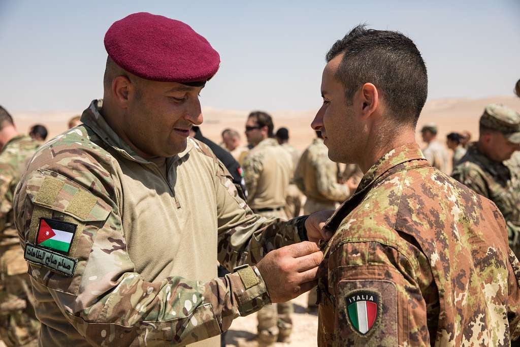 A paratrooper from the Italian Armed Forces receives - NARA & DVIDS ...