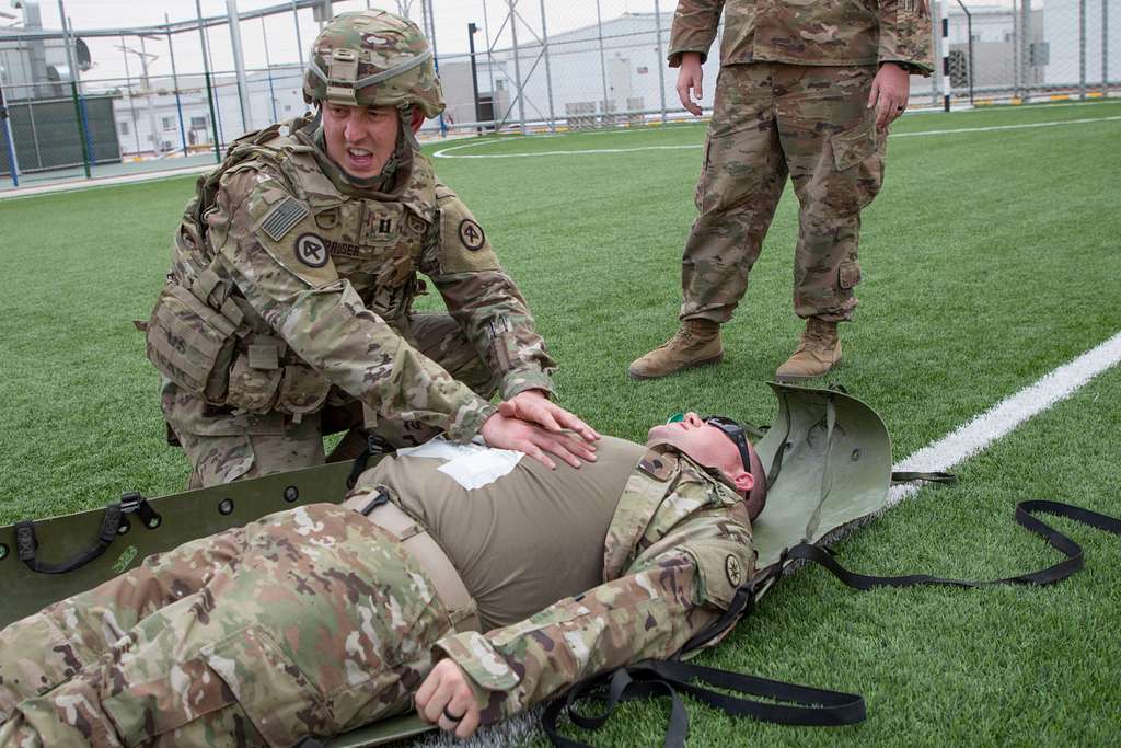 A U.S. Army Soldier provides tactical field care to - NARA & DVIDS ...