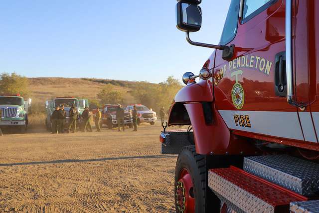 Staley Myers (right), a captain with San Diego Fire Department briefs  Marines and firefighters during a training exercise in San Diego, June 21.  Marine Corps Air Station Miramar Aircraft Rescue and Firefighting