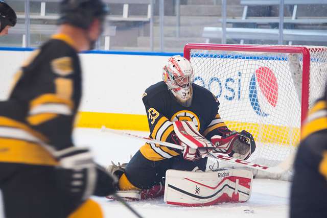 Members of the Navy, Marine Corps, and Coast Guard hockey team, in blue,  and the Air Force and Army team participate in the Wounded Warriors Charity  Hockey game. - PICRYL - Public