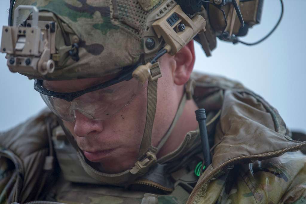 A Tactical Air Control Party Airman plans a land navigation - PICRYL ...