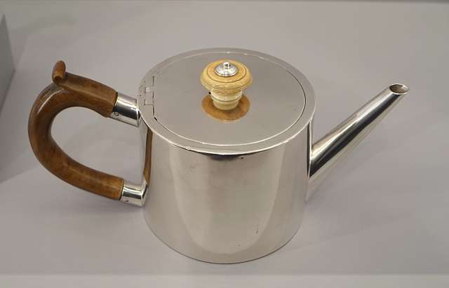 https://cdn2.picryl.com/photo/2019/11/30/teapot-by-robert-makepeace-i-british-1777-1778-silver-fruitwood-ivory-fogg-b94e9e-640.jpg