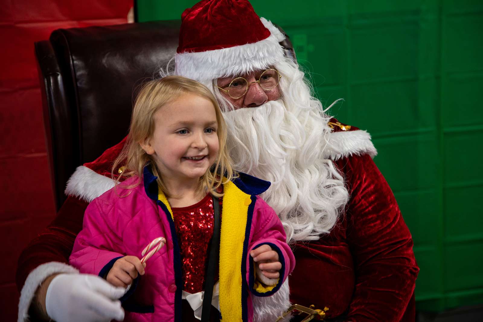 A child meets Santa Claus during a holiday event at - NARA & DVIDS ...