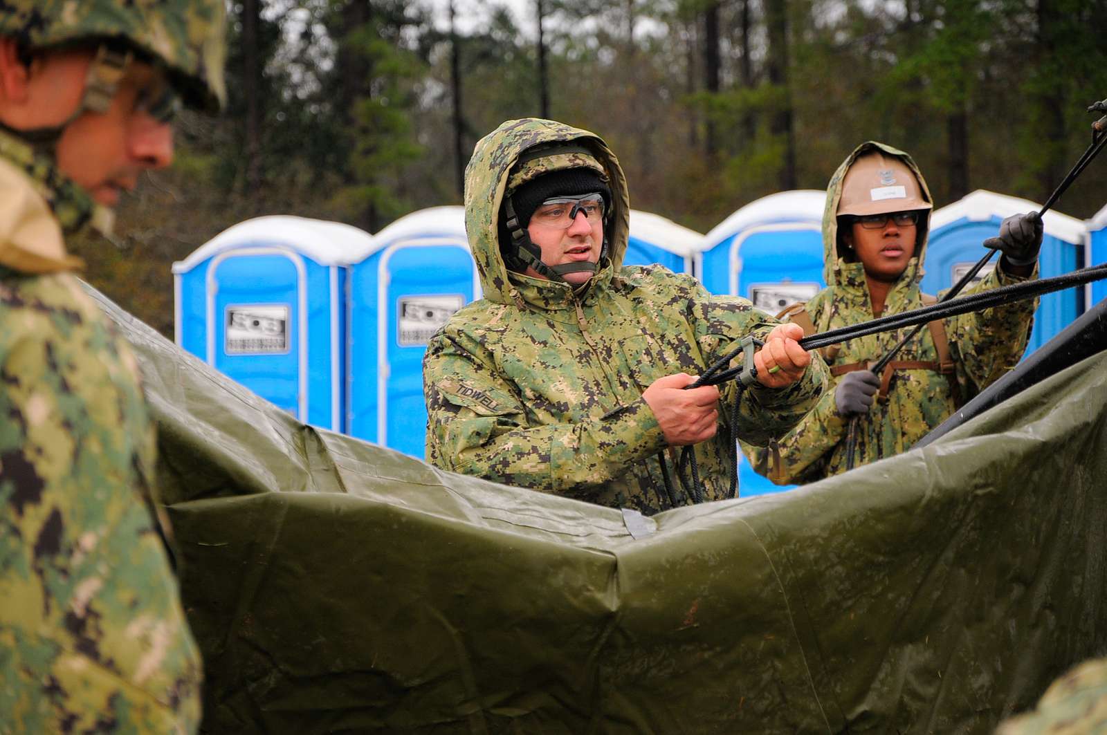 Sgt. 1st. Class. Richard Erskine, a jumpmaster for 1st Brigade Combat Team,  82nd Airborne Division, demonstrates how to properly hook up his static line  during a pre-jump class at Robert Gray Army