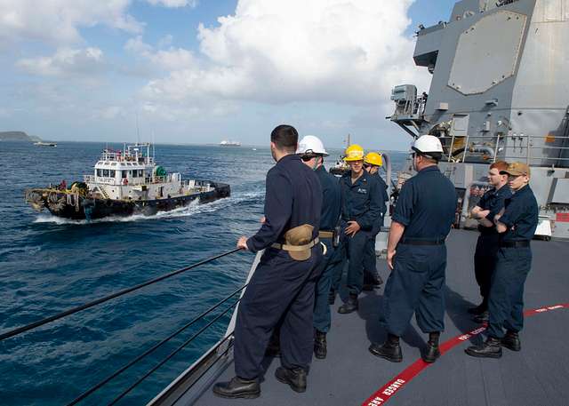 NAVAL BASE GUAM (Feb. 14, 2020) A tug boat follows - NARA & DVIDS ...