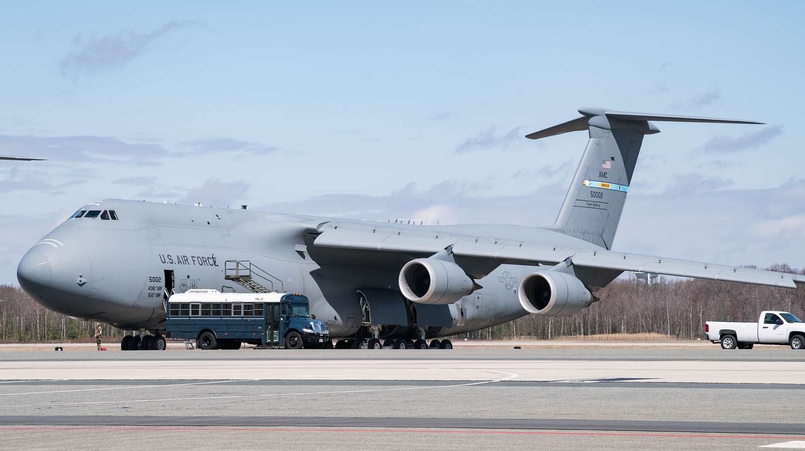 A bus parks in front of a C-5M Super Galaxy March 17, - NARA & DVIDS ...