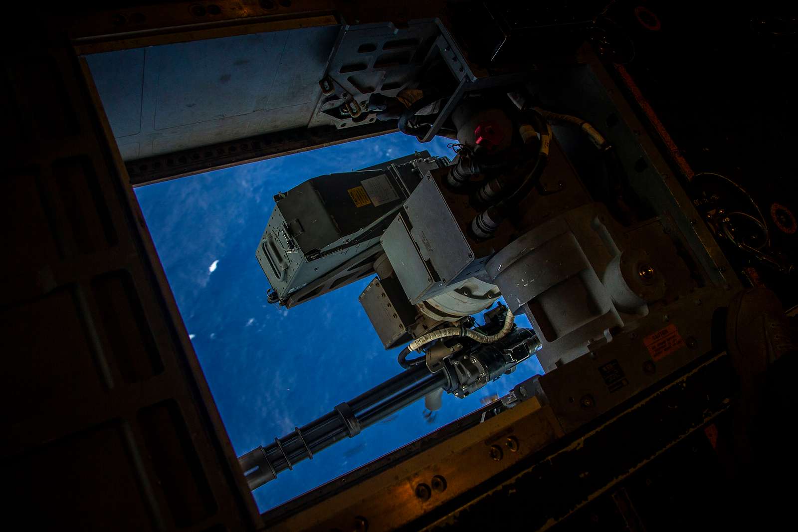 A GAU-17A fires at its target during defensive weapon - NARA & DVIDS ...