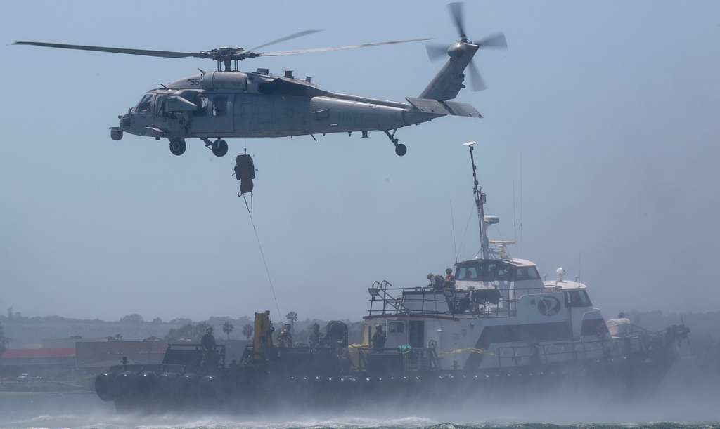 A U.S. Navy MH-60S Seahawk helicopter with Helicopter - NARA & DVIDS ...