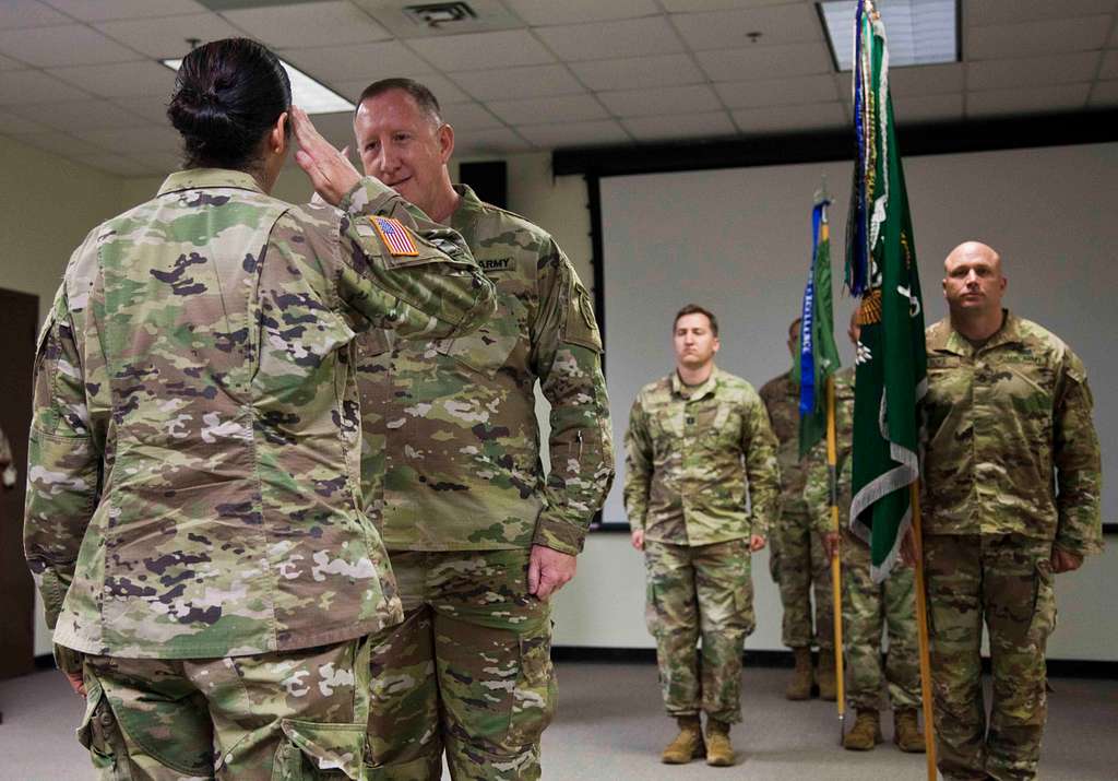 Outgoing Commander, Lt. Col. Kyle Henson, salutes the - NARA & DVIDS ...