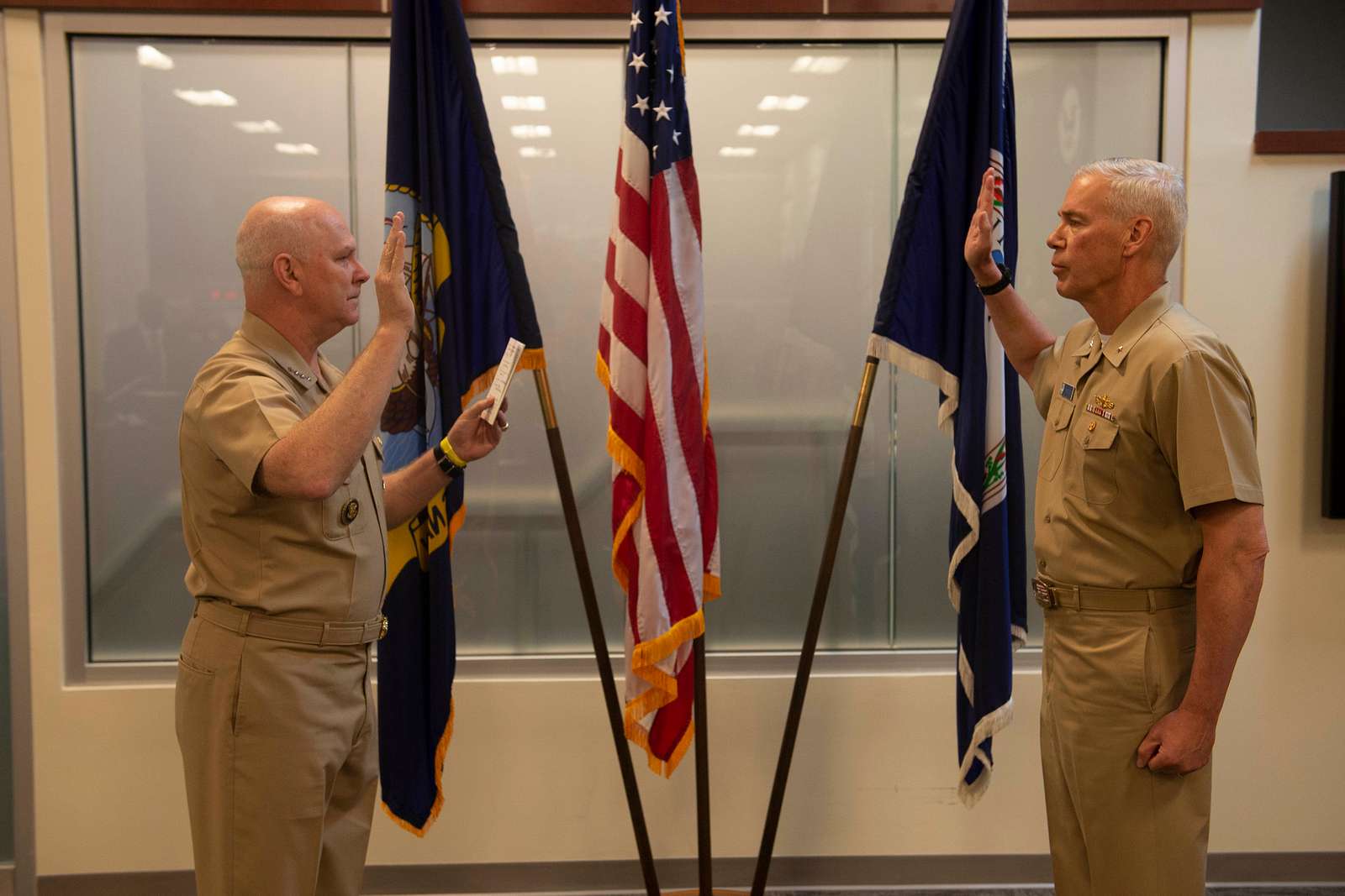 Command Sgt. Maj. John Hicks, right, Senior Enlisted Noncommissioned  Officer, Al Asad Air Base and 42nd Regional Support Group, New Jersey  National Guard, presents a coin to the Task Force Vikings outgoing