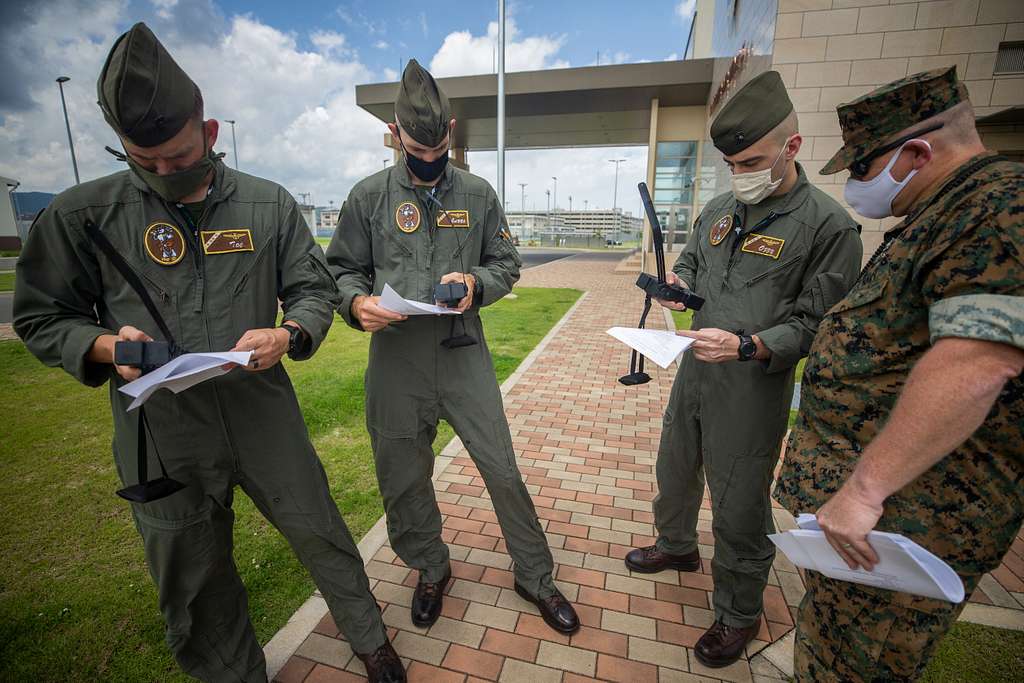 US Navy Engineman 2nd Class Anthony Bartelli (right) holds an