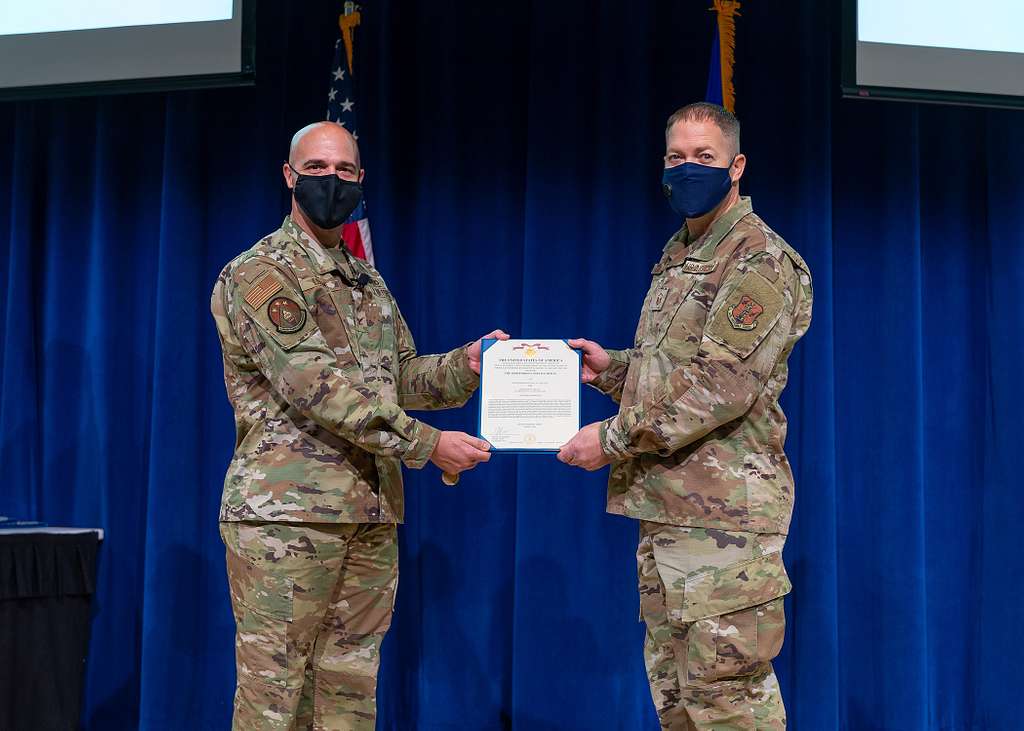 U.S. Air Force Master Sgt. Kelly Collett receives a - PICRYL Public ...