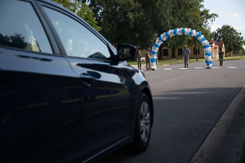 A staff sergeantselect drives toward a balloon arch NARA & DVIDS
