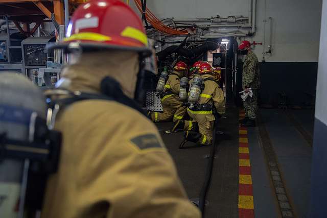 U.S. Navy Sailors fight a simulated fire during an - NARA & DVIDS ...