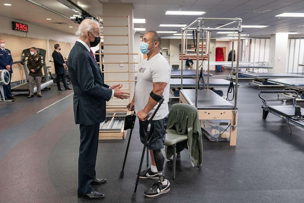 President Joe Biden greets Ret. U.S. Army Sgt. Peter Francis, his