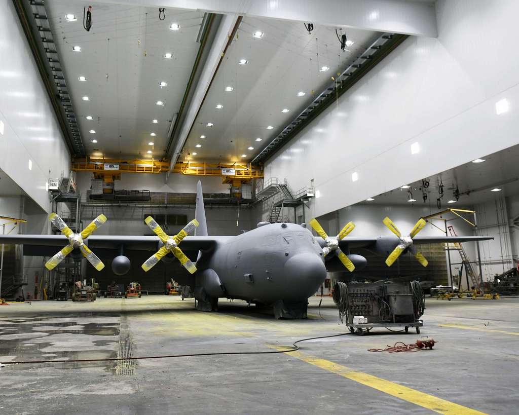 A C-130 aircraft sits in a hanger as a fresh coat of - NARA & DVIDS ...