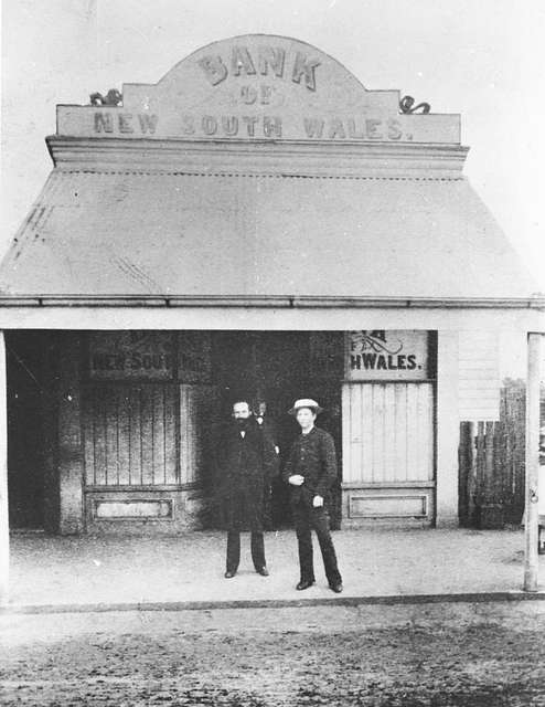 https://cdn2.picryl.com/photo/2021/02/23/statelibqld-1-151255-men-standing-outside-the-bank-of-new-south-wales-in-south-371cb3-640.jpg