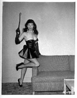 Betty Page Klaw 8 - A black and white photo of a woman posing on a