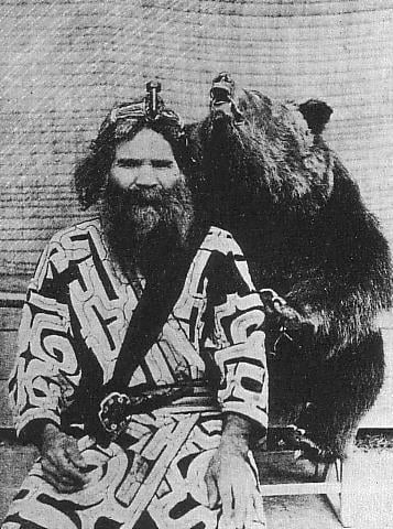 One Ainu man and bear. Japanese empire during World War Two