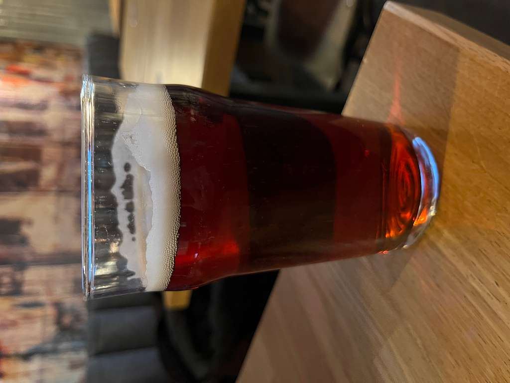 A close up of a glass of beer on a table. Beer peroni glass. - PICRYL -  Public Domain Media Search Engine Public Domain Image