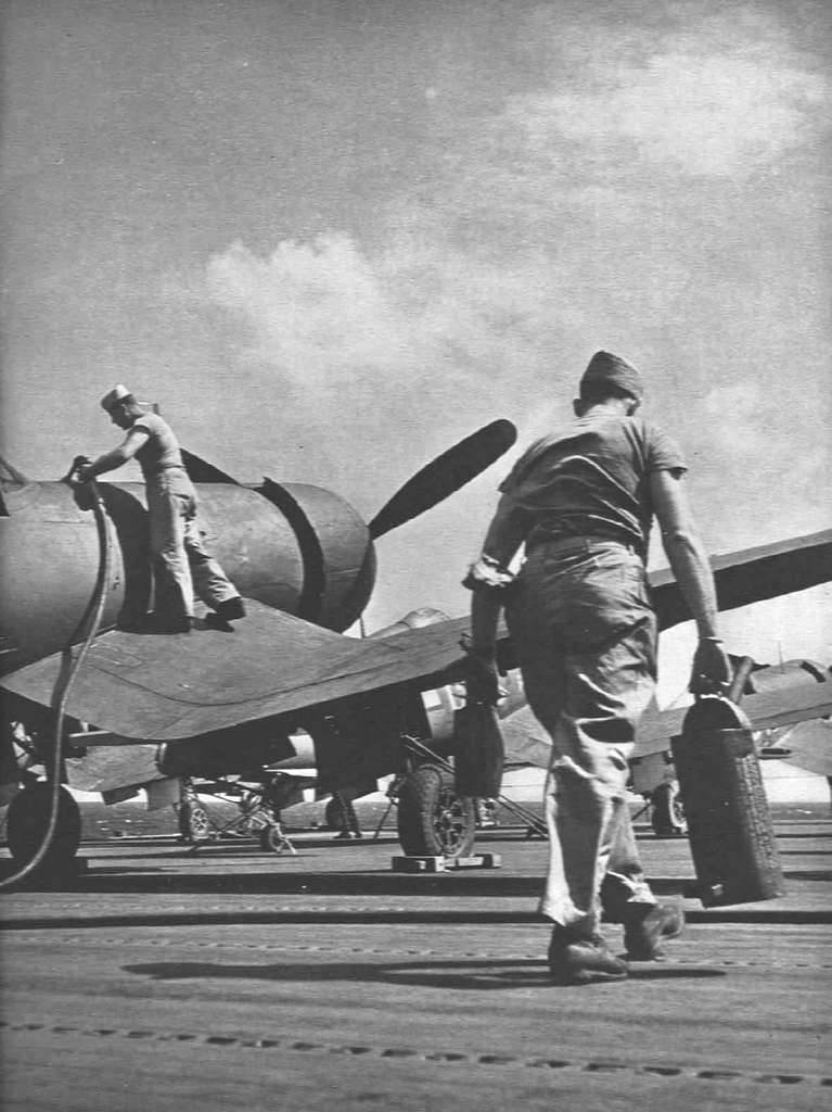 F4U-1 Corsairs are refueled aboard USS Franklin (CV-13) in early 1945 ...