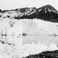 A distant bow view of 'Endurance' (1912) frozen into the ice floe