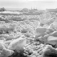 A distant bow view of 'Endurance' (1912) frozen into the ice floe