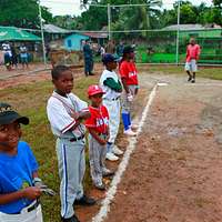 CAMP FOSTER, Okinawa, Japan – A child practices batting at a youth baseball  clinic July 29 aboard Camp Foster, Okinawa, Japan. The baseball clinic  hosted four different stations: hitting, running, catching and