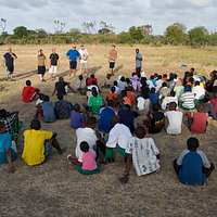 Miguel Descartes Batista Jerez, a retired Major League Baseball player from  the Dominican Republic, coaches participants on pitching form during a  baseball clinic the task force hosted for area children May 20