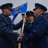 Col. Lorenzo Bradley, 460th Operations Group commander, accepts