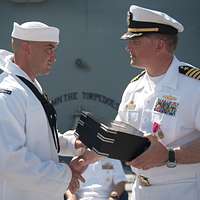 Capt. Thomas Halvorson, the outgoing commanding officer - NARA