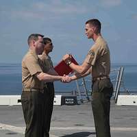 Sgt. Maj. Carlos Ruiz (center), outgoing sergeant major - NARA