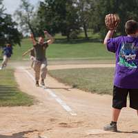 CAMP FOSTER, Okinawa, Japan – A child practices batting at a youth baseball  clinic July 29 aboard Camp Foster, Okinawa, Japan. The baseball clinic  hosted four different stations: hitting, running, catching and