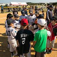 CAMP FOSTER, Okinawa, Japan – A child practices batting at a youth baseball  clinic July 29 aboard Camp Foster, Okinawa, Japan. The baseball clinic  hosted four different stations: hitting, running, catching and