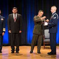 The Legion of Merit with Third Oak Leaf Cluster was presented to COL  Charles B. Eichelberger, by MGEN Louis C. Menetrey, director of  Requirements, Officer of the Deputy CHIEF of STAFF Operations.