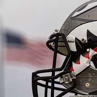 A U.S. Air Force Academy football team helmet and jersey are displayed on  the flightline at Davis-Monthan Air Force Base, Ariz., Dec. 27, 2016. The  helmet's design replicates the one used for