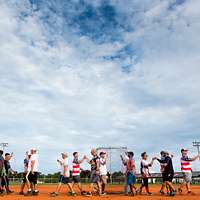 CAMP FOSTER, Okinawa, Japan – A child practices batting at a youth baseball  clinic July 29 aboard Camp Foster, Okinawa, Japan. The baseball clinic  hosted four different stations: hitting, running, catching and