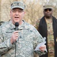 Brig. Gen. Kevin Vereen, deputy commanding general operations for U.S. Army  Recruiting Command, prepares to give the Oath of Enlistment Nov. 12 to  nearly 100 Future Soldiers during halftime of the Washington