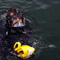 US Navy Engineman 2nd Class Anthony Bartelli (right) holds an