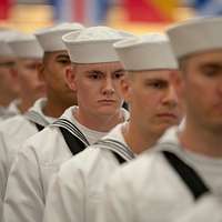 File:US Navy 070208-N-4965F-001 A young patron hands a football to