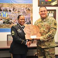 Sgt. Maj. Carlos Ruiz (right), outgoing sergeant major - NARA