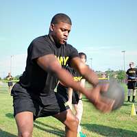 File:US Navy 070208-N-4965F-001 A young patron hands a football to