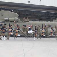 Los Angeles Rams cheerleaders pose with a child during - PICRYL