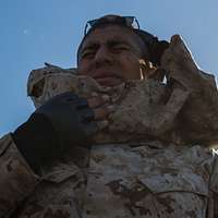 A recruit from Mike Company, 3rd Recruit Training Battalion, applies a choke  hold during a Marine Corps Martial Arts Program test at Marine Corps  Recruit Depot San Diego, July 20. The recruits