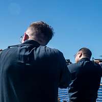 060811-N-7526R-093 (Aug. 11, 2006)San Diego Chargers running back LaDanian  Tomlinson (56) looks on as his team conduct awalk-throughon the flight  deck aboard US Navy (USN) Nimitz Class Aircraft Carrier USS RONALD REAGAN (